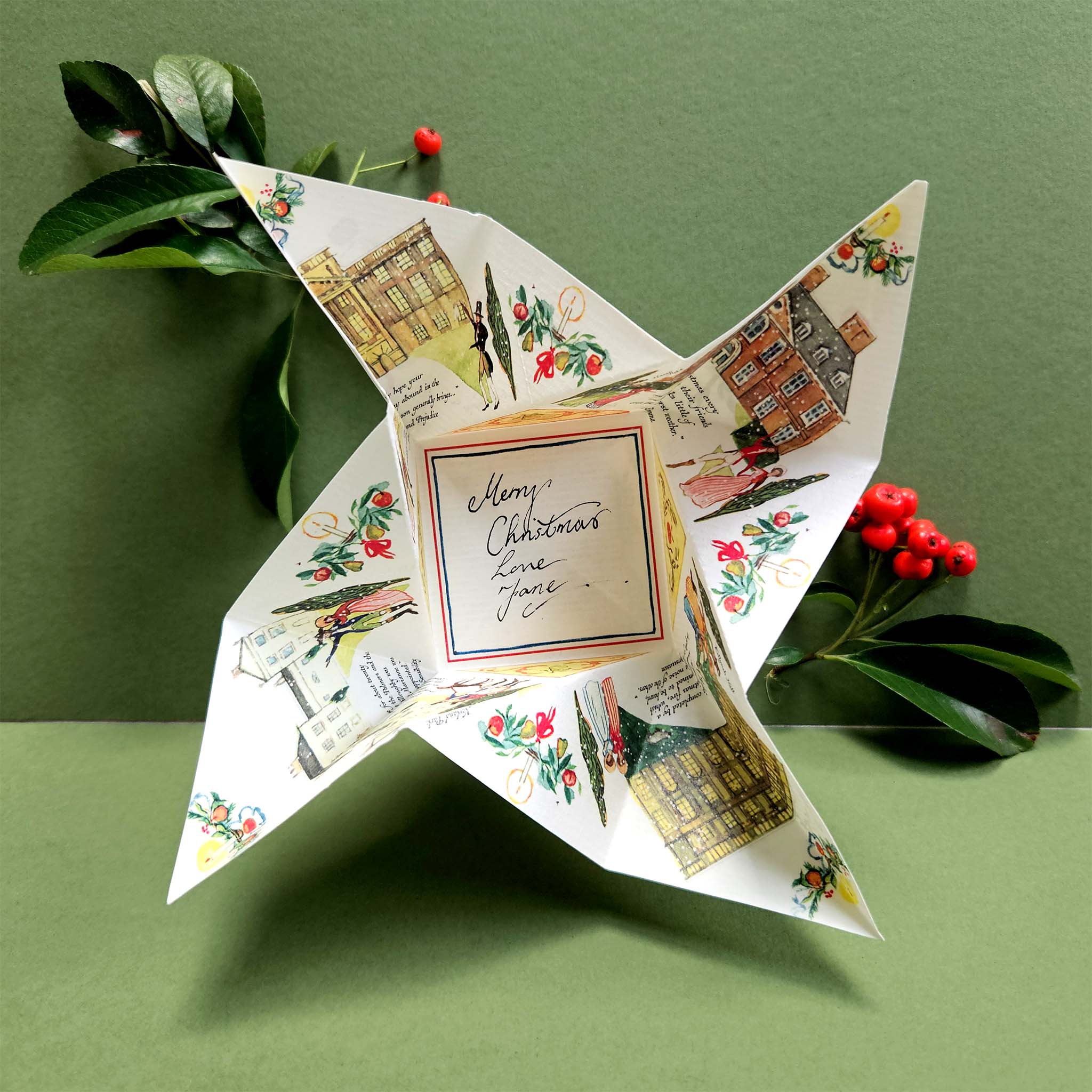 Decorative paper star with regency-style Christmas illustrations on a green background