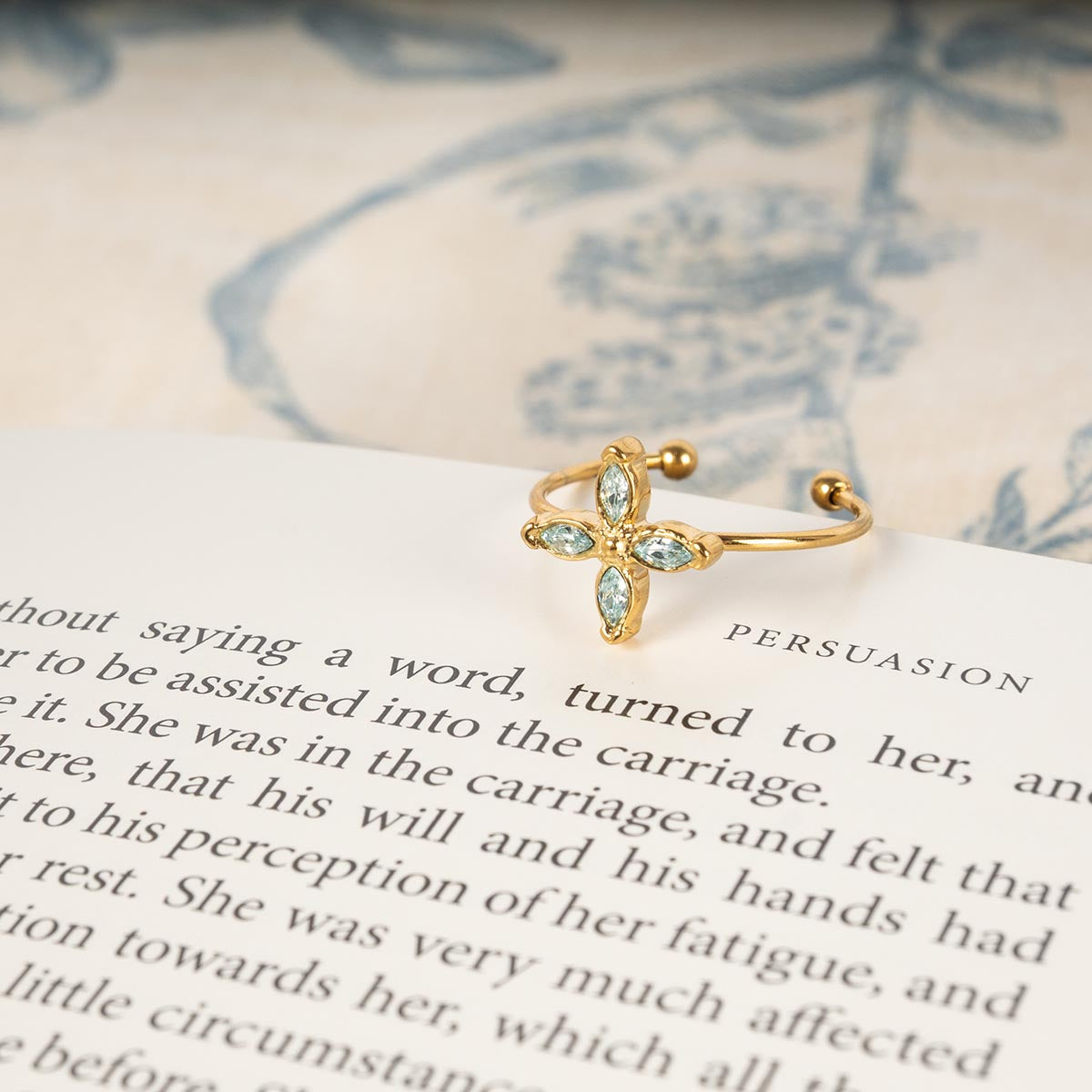 Ring resting on a Persuasion novel.