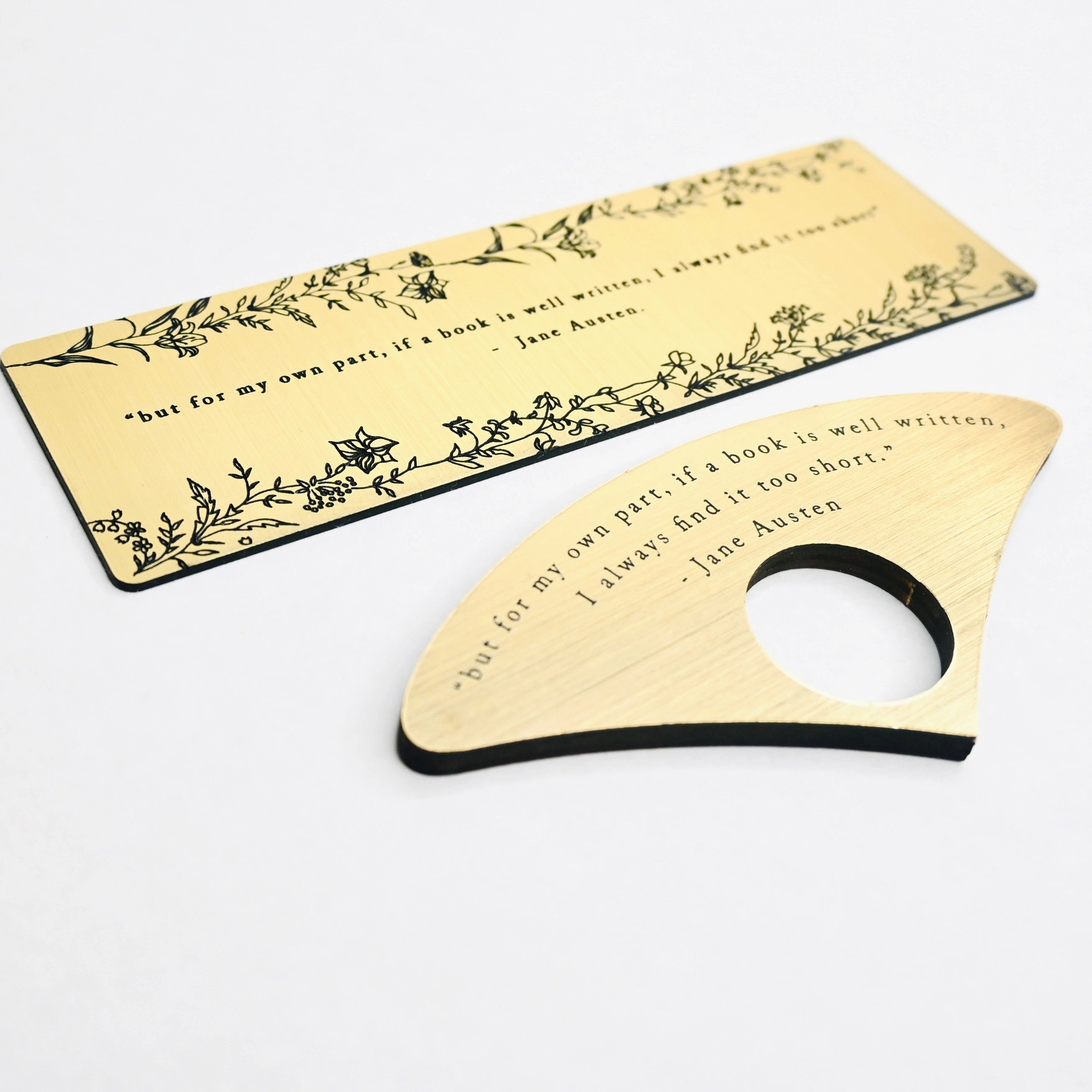 Bookmark and Page Spereader with brushed gold acrylic featuring an engraved quote 'but for my own part, if a book is well written, I always find it too short' - Jane Austen.