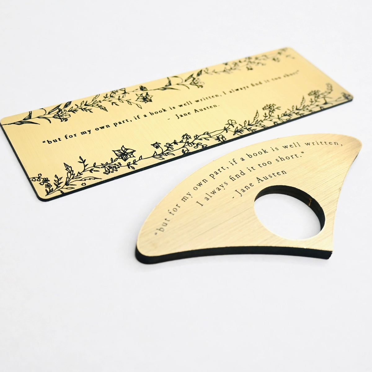 Bookmark and Page Spereader with brushed gold acrylic featuring an engraved quote 'but for my own part, if a book is well written, I always find it too short' - Jane Austen.