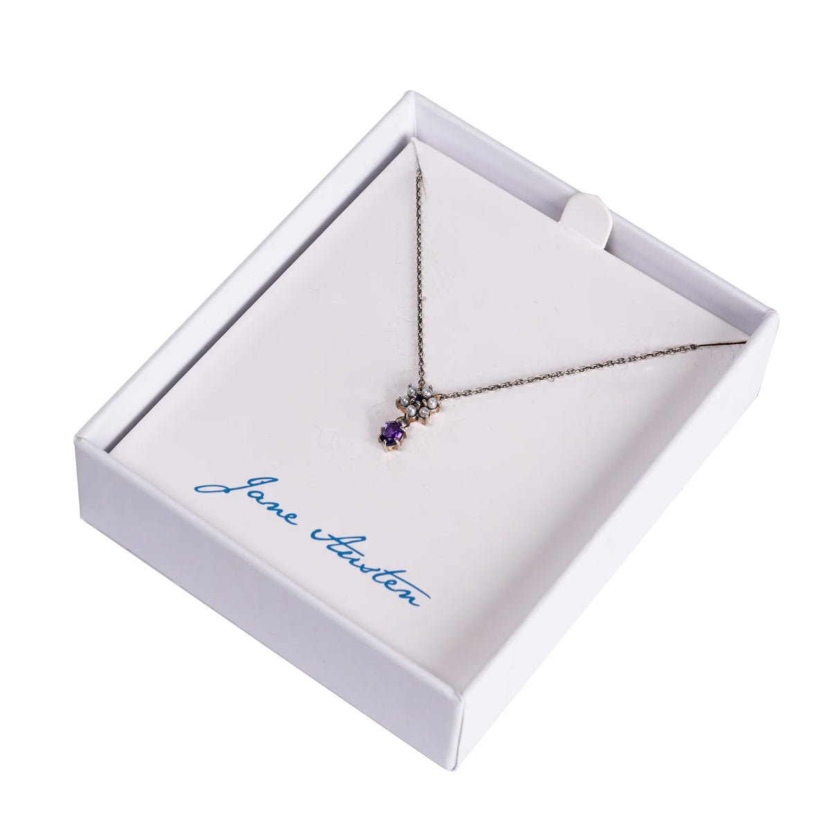 A sterling silver necklace with freshwater pearls and an amethyst gemstone, presented in a white box with 'Jane Austen' signature.