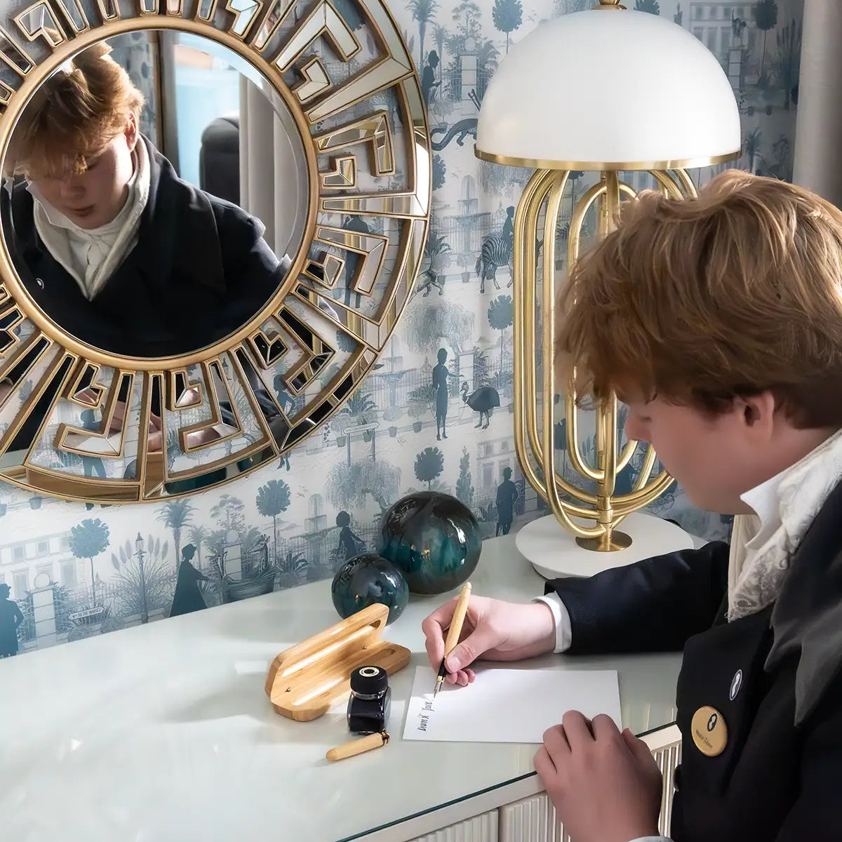 Model uses pen to write a note. Located in Queensberry Hotel, Bath.