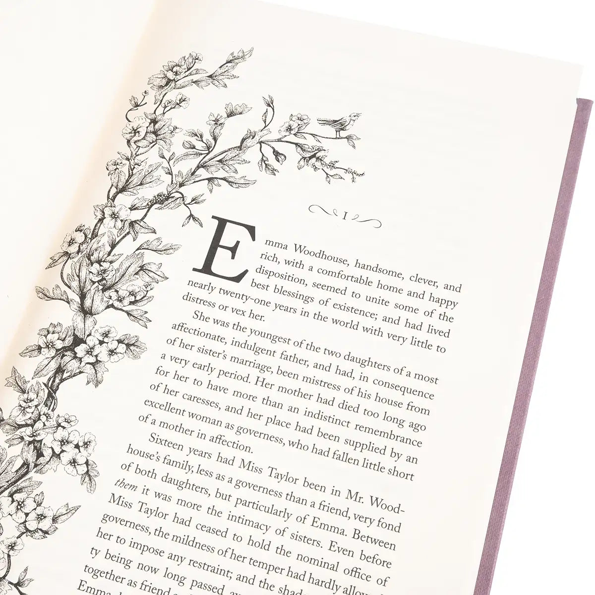 Book page with decorative floral design and text