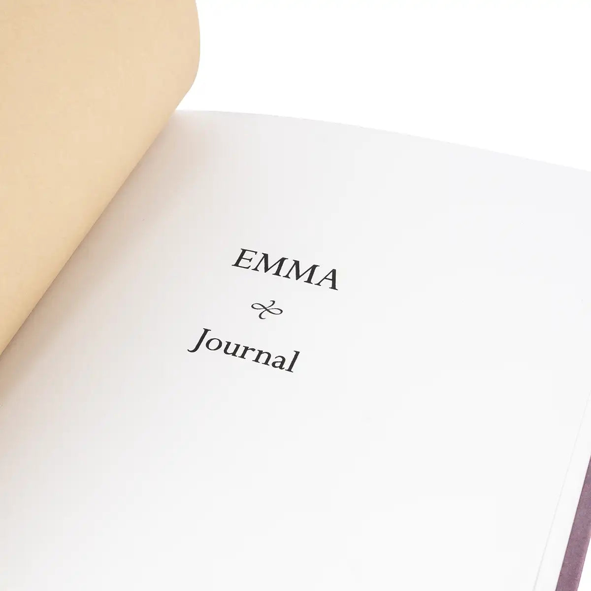 Journal with 'EMMA Journal' text on a white background