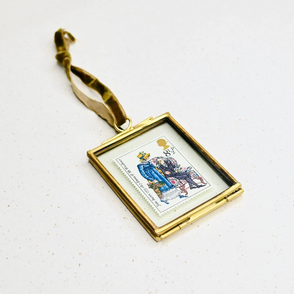 Gold-framed postage stamp with an illustration of Emma and Mr Woodhouse.