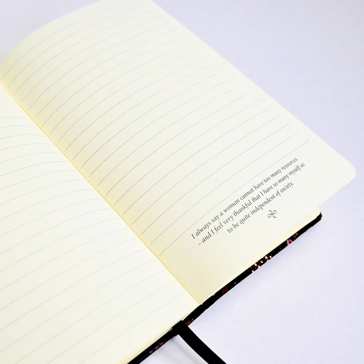Page opened to lined pages, one of which has a quote from Emma at the bottom.