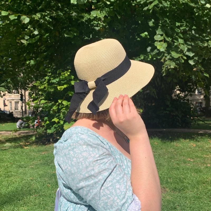 Regency Bonnet Style Sun Hat worn by a woman outdoors