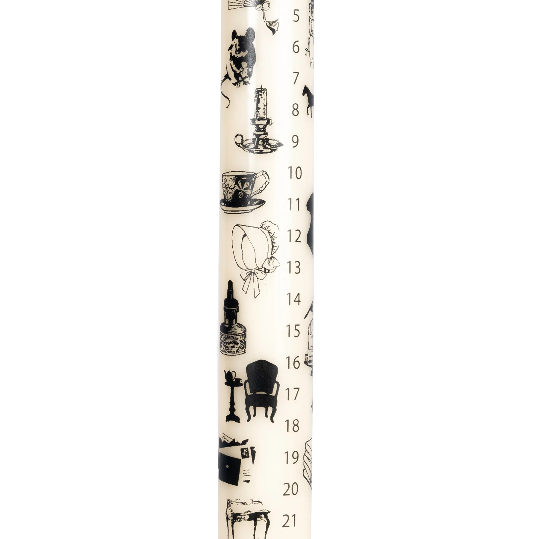 Closeup of Christmas Advent Candle with regency icons like chairs, bonnets and teacups