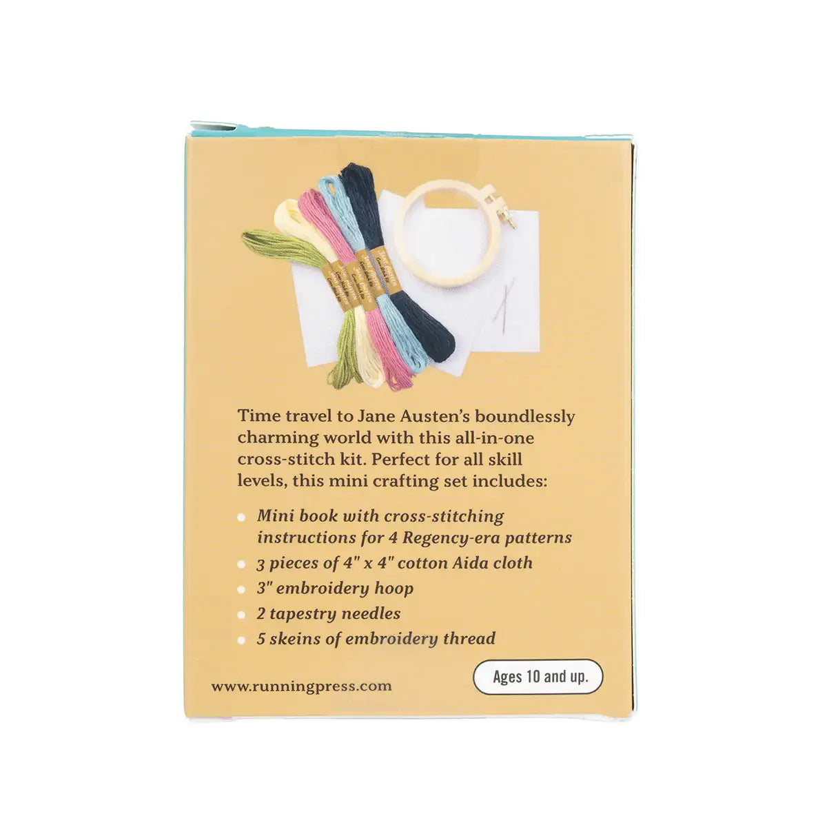 Cross-stitch kit packaging with embroidery thread and hoop on a beige background