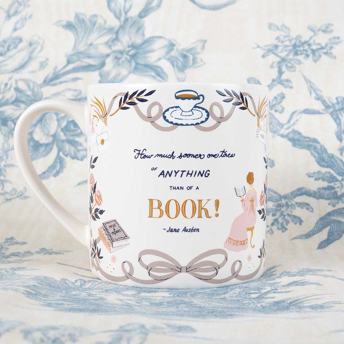 Jane Austen quote mug on a blue patterned background