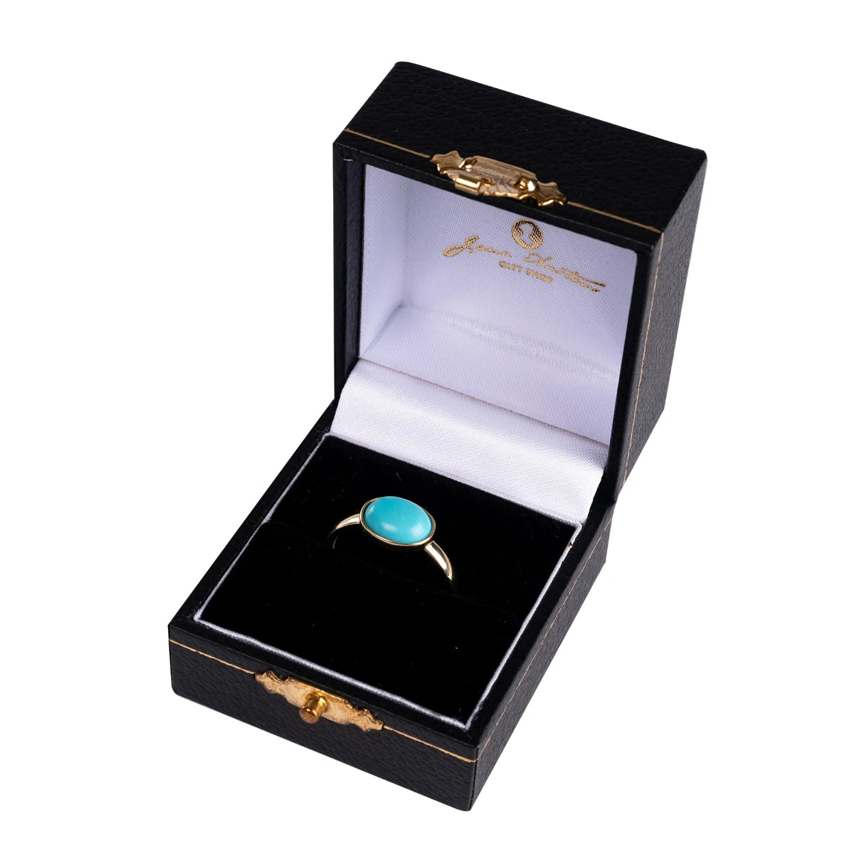 A gold-plated sterling silver ring with a turquoise stone, displayed in an open black box with gold trimmings, branded with the Jane Austen Centre.