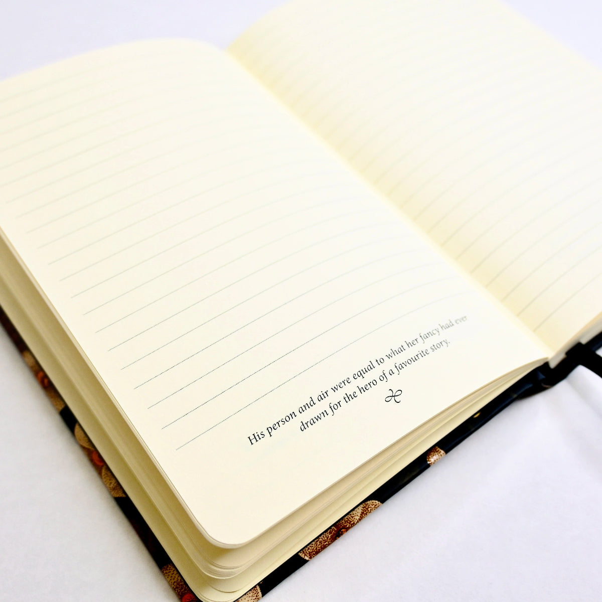 Journal open to show two lined pages. At the bottom of one page is a quote rom the novel "Sense and Sensibility".