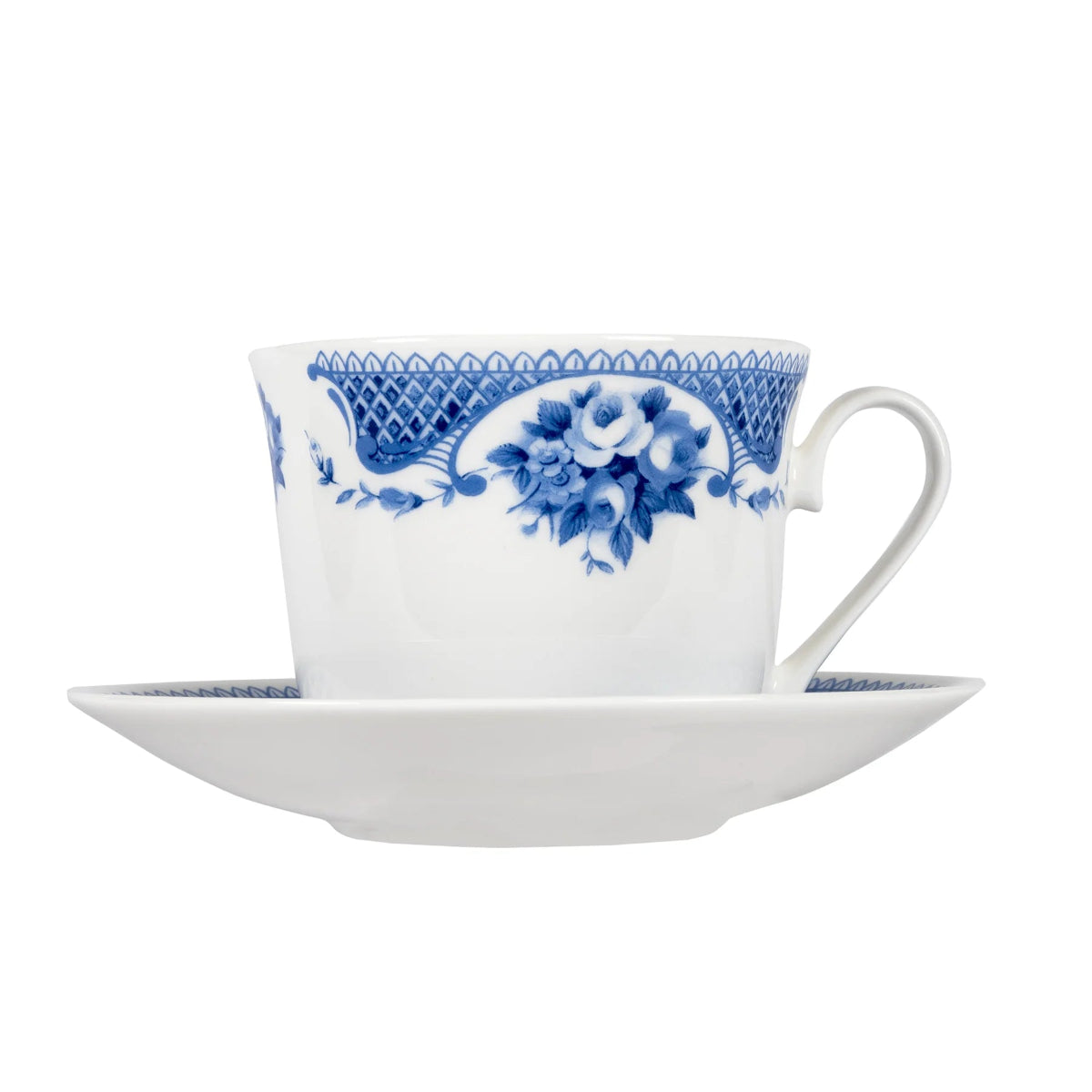 White teacup and saucer with blue floral pattern on a white background