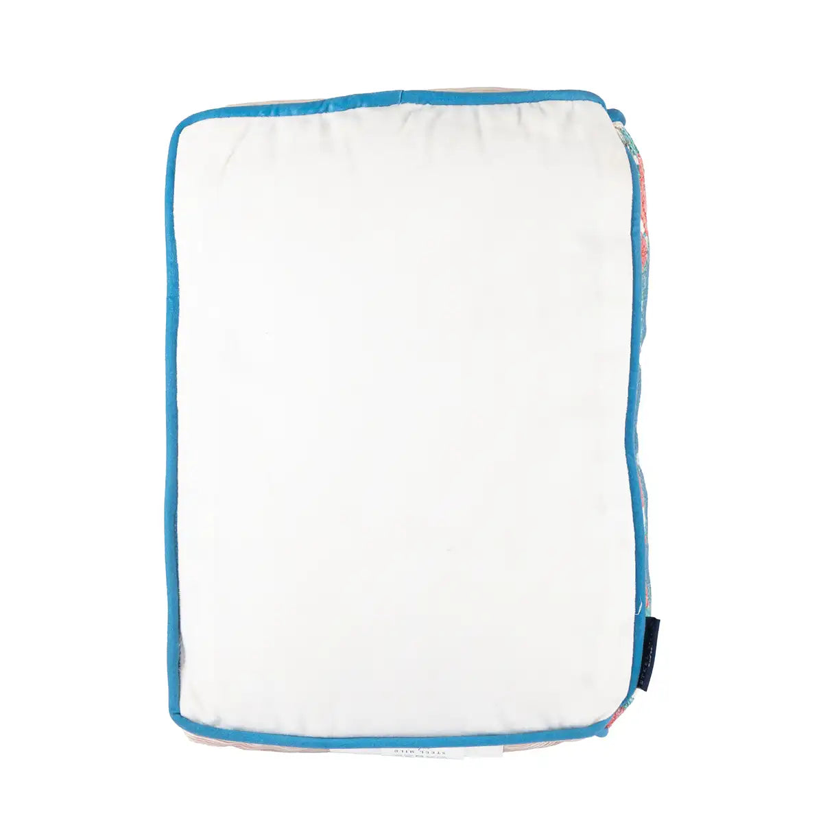 White pillow with blue trim on a white background