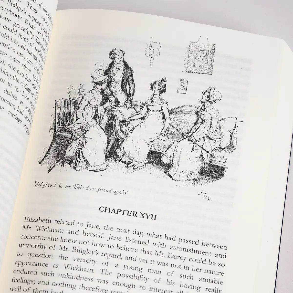 Chapter XVII of Jane Austen's Pride and Prejudice featuring an illustration of a scene from the story and the caption 'delighted to see their dear friend again'