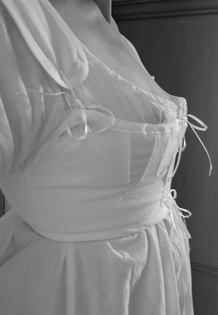 Close up black and white shot of details on a handmade regency underthings dress