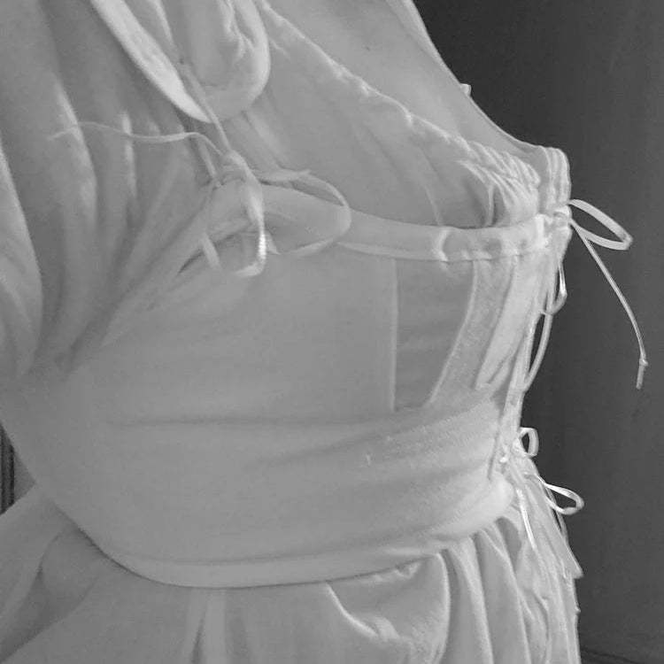 Close up black and white shot of details on a handmade regency underthings dress