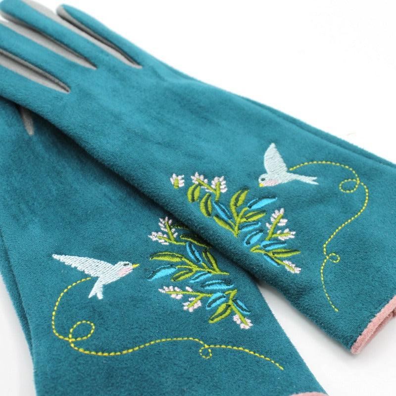 Teal-coloured gloves with embroidered flowers and bird details.