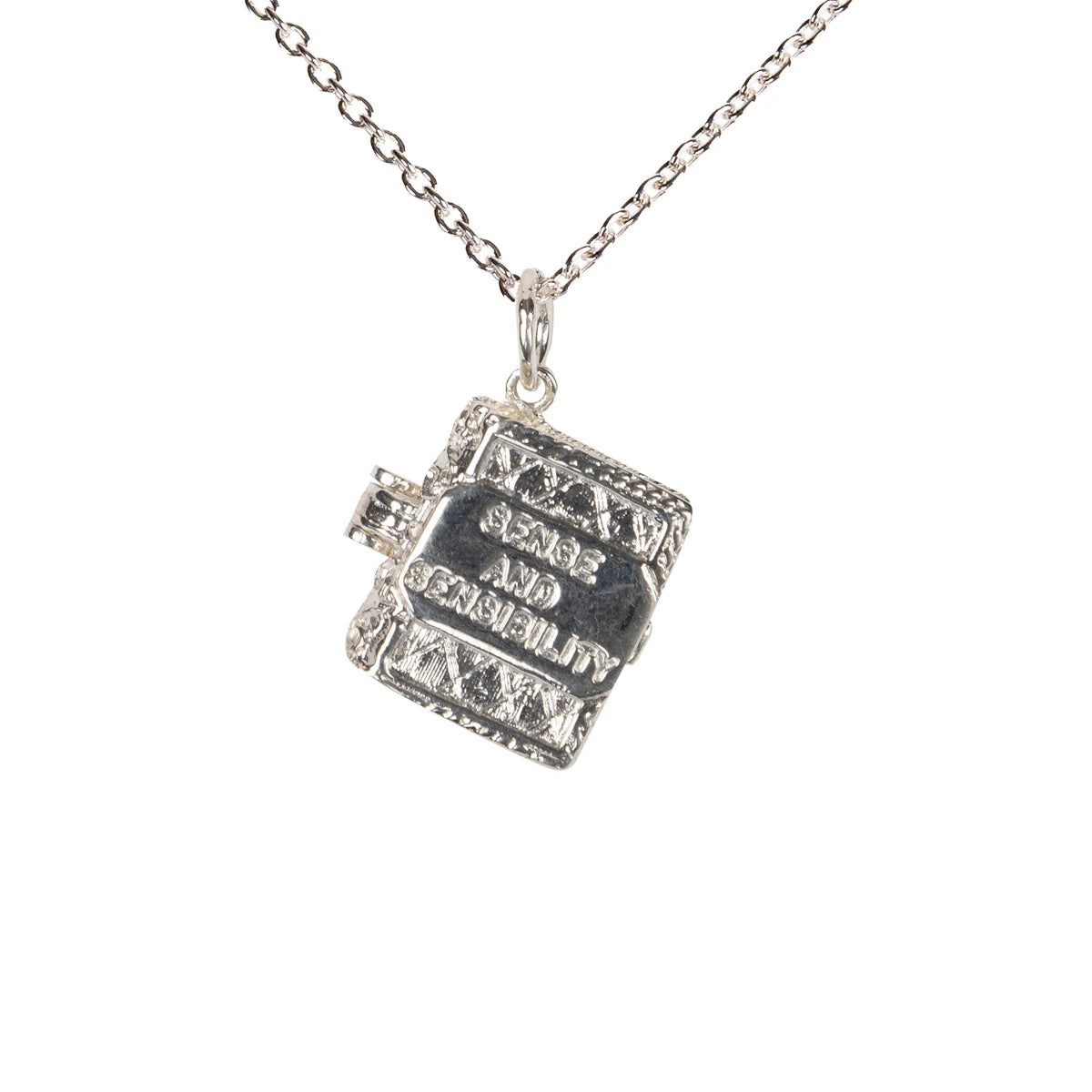 Silver Sense and Sensibility charm on silver chain in front of a white background.