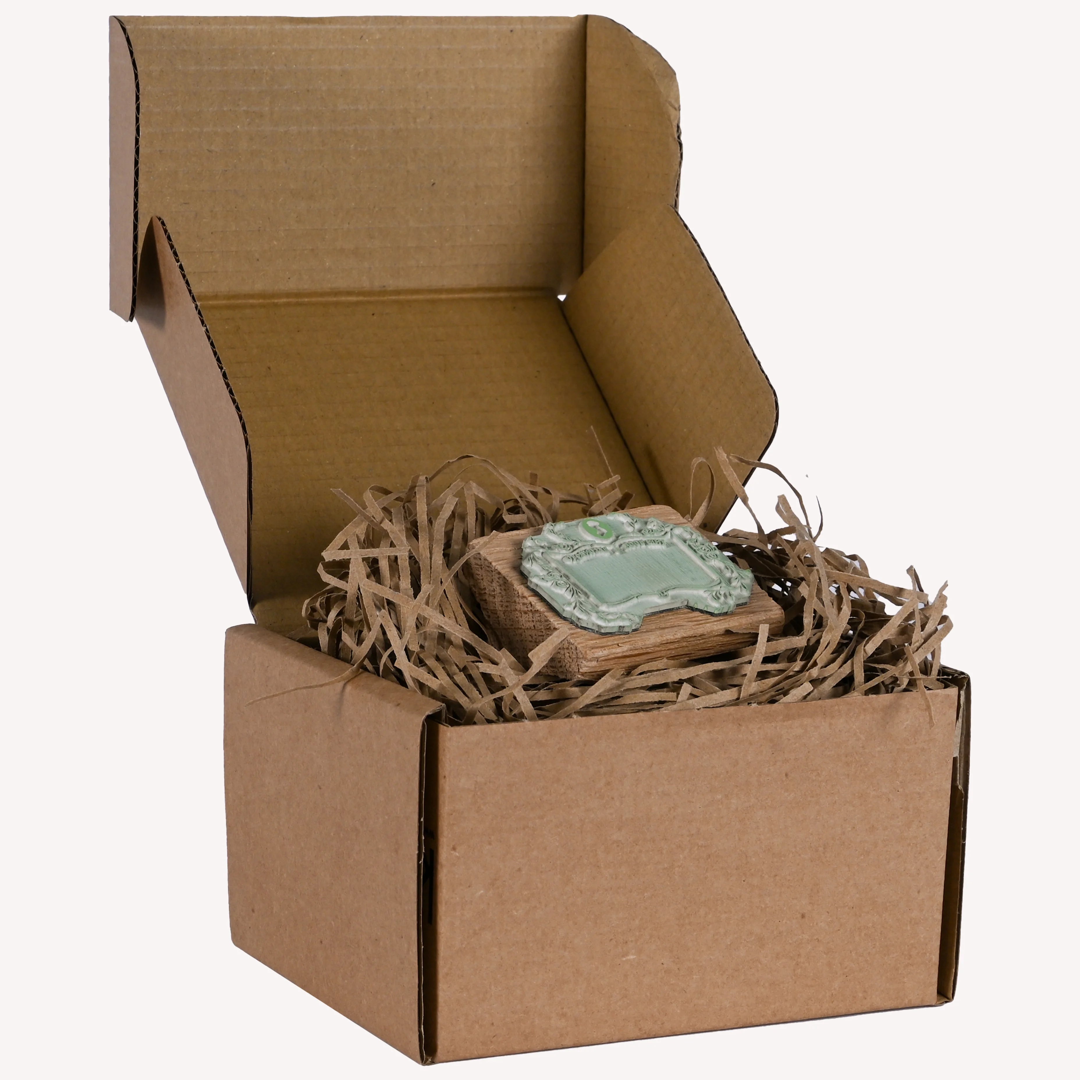 Wooden stamp in Box with a Jane Austen logo, floral framing and backwards text "This book belongs to"