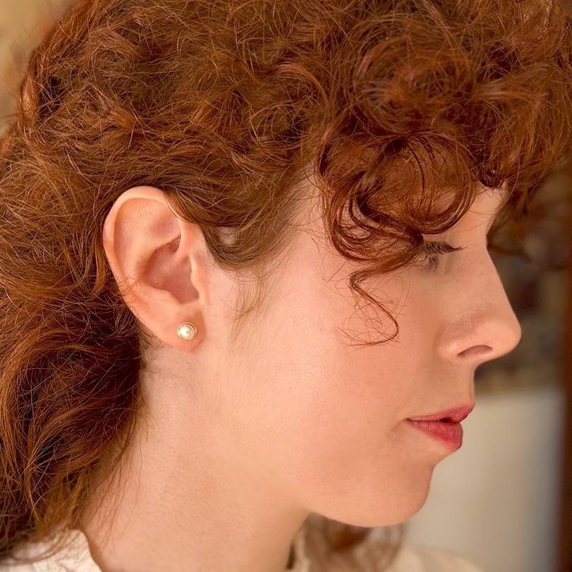 Side image of model wearing pearl style Elinor Dashwood earring