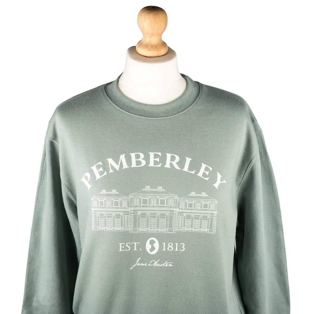 Green Jane austen themed sweater with Pemberley on it
