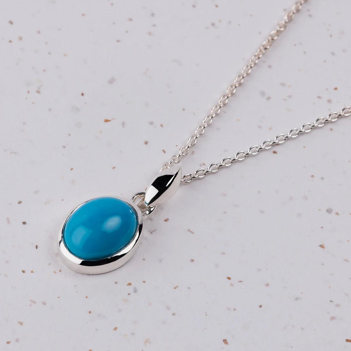 Closeup of Turquoise Pendant on a silver Necklace