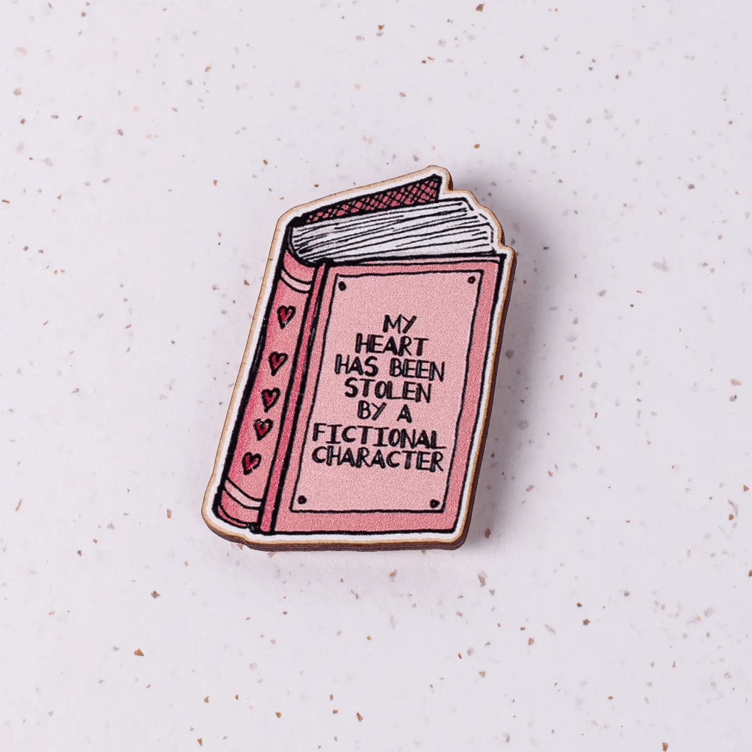 "My heart has been stolen by a fictional character." Pink book design