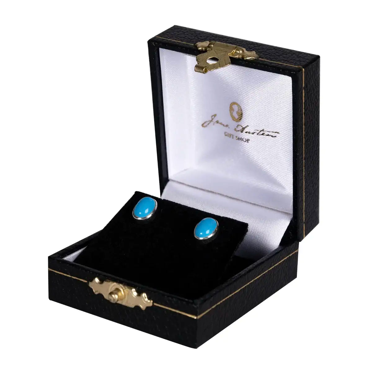 Oval stud earrings featuring blue turquoise set in silver in a jewellery box with Jane Austen logo