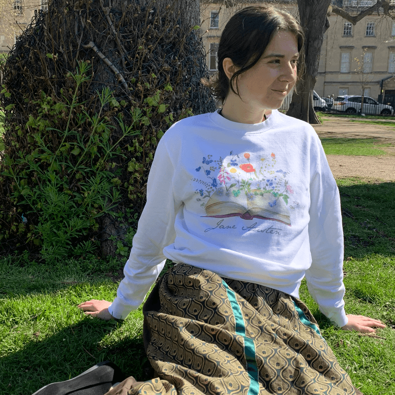 Wear Jane Austen's iconic signature with our beautiful blossoming books design sweater.   Made from a soft blend of 80% cotton and 20% polyester, the modern design compliments the wondrously classical novels that Jane Austen is famous for. 