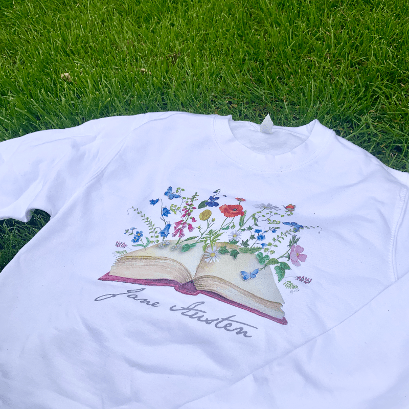 Wear Jane Austen's iconic signature with our beautiful blossoming books design sweater. Made from a soft blend of 80% cotton and 20% polyester, the modern design compliments the wondrously classical novels that Jane Austen is famous for.