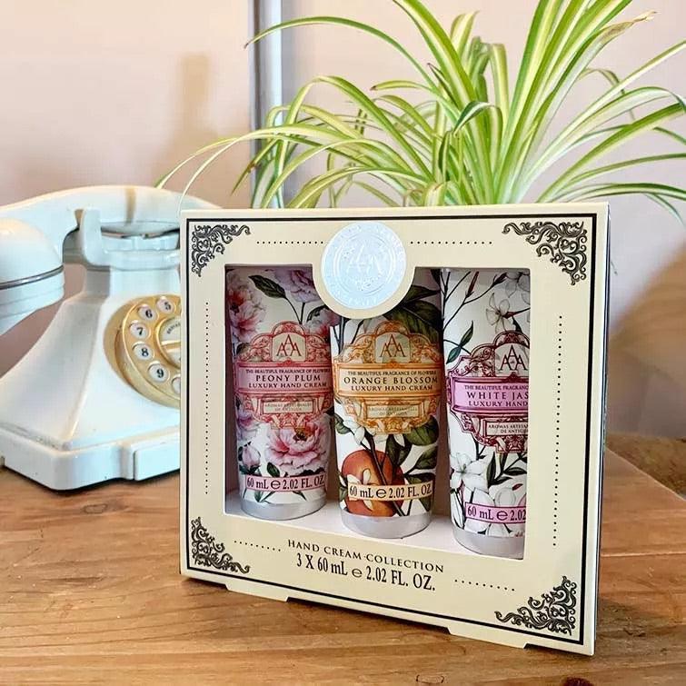 A delicately decorated box, houses three hand creams. Peony plum, orange blossom, and white jasmine. All with summery fruitful designs on the tubes