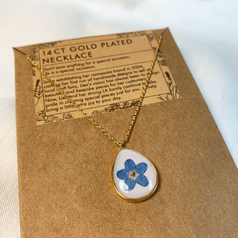 the necklace is shown here on the display card that states "14ct gold plated necklace" Jane Austen Jewellery