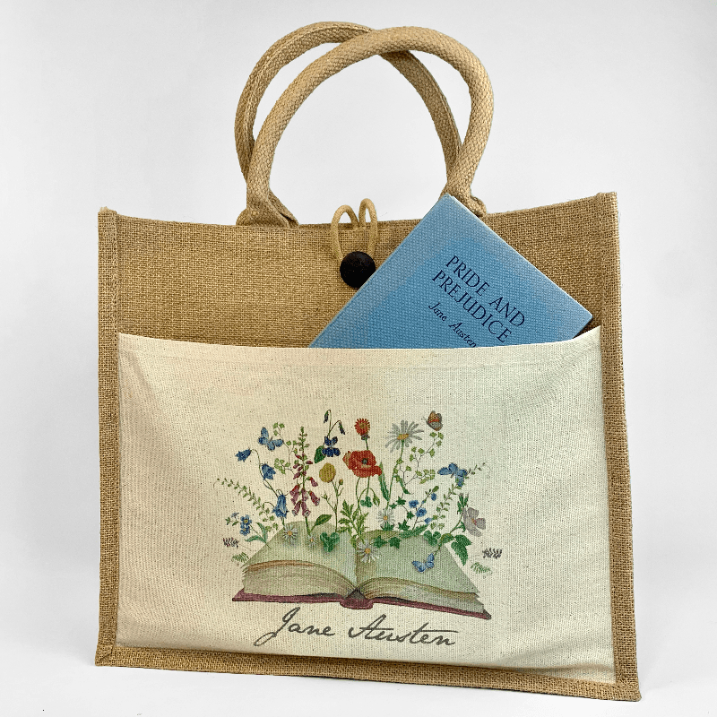 Here the book is shown pocking out the top of the front pocket which displays the bookish floral design, reminiscent of Jane Austen's love for the traditional English garden and the gardens of netherfield house