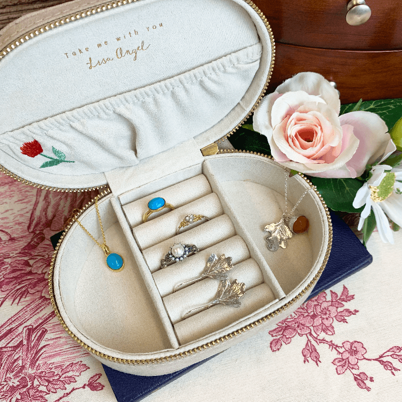 The lady catherine's jewellery box is displayed with necklaces, rings, an earrings, organised within the boxes roomy storage