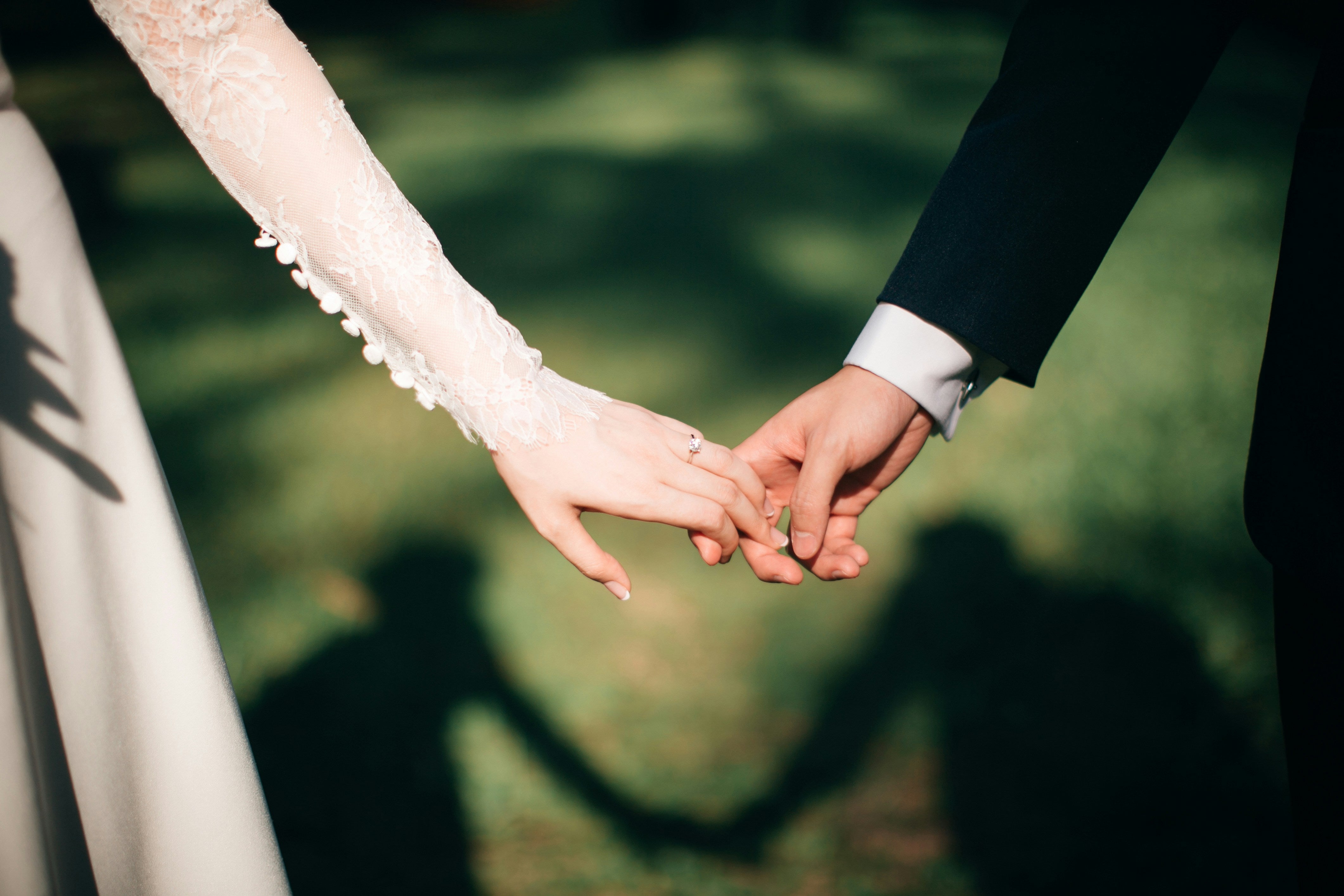 Wedding, a couple holding hands