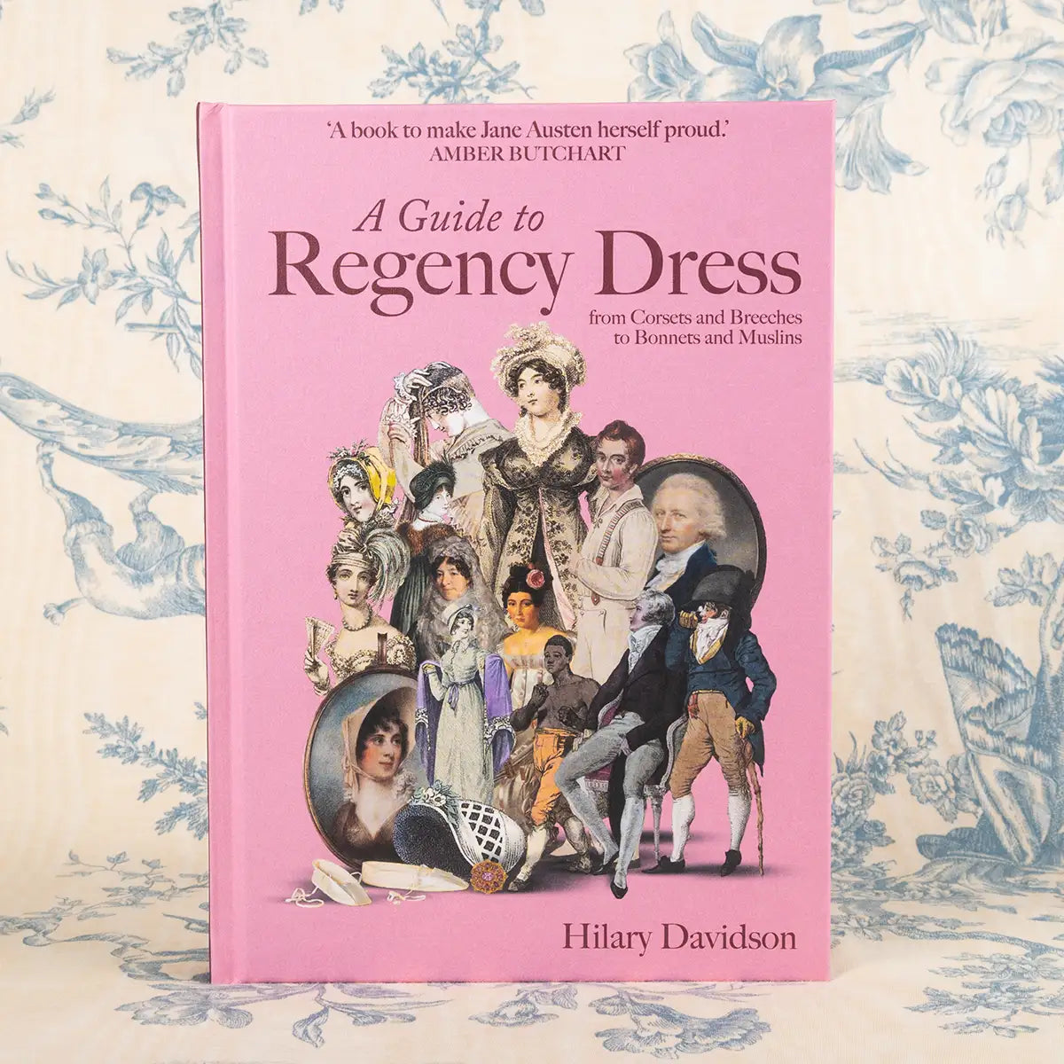 Front cover - pink and decorated with Regency illustrated people and accessories.