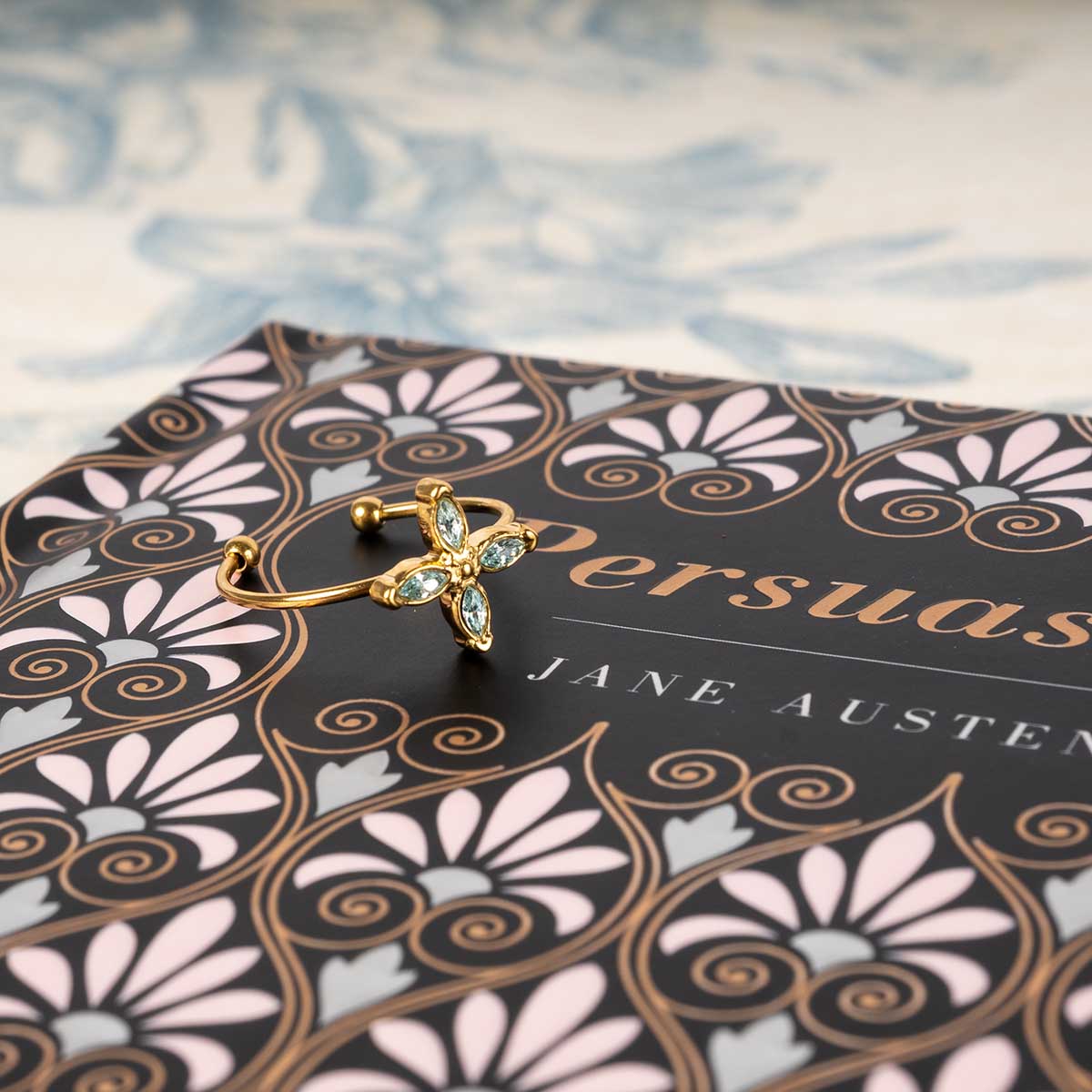 Ring resting on a Persuasion novel.