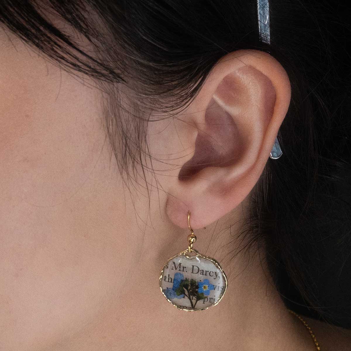 Book Page Earring lifestyle image of ear.