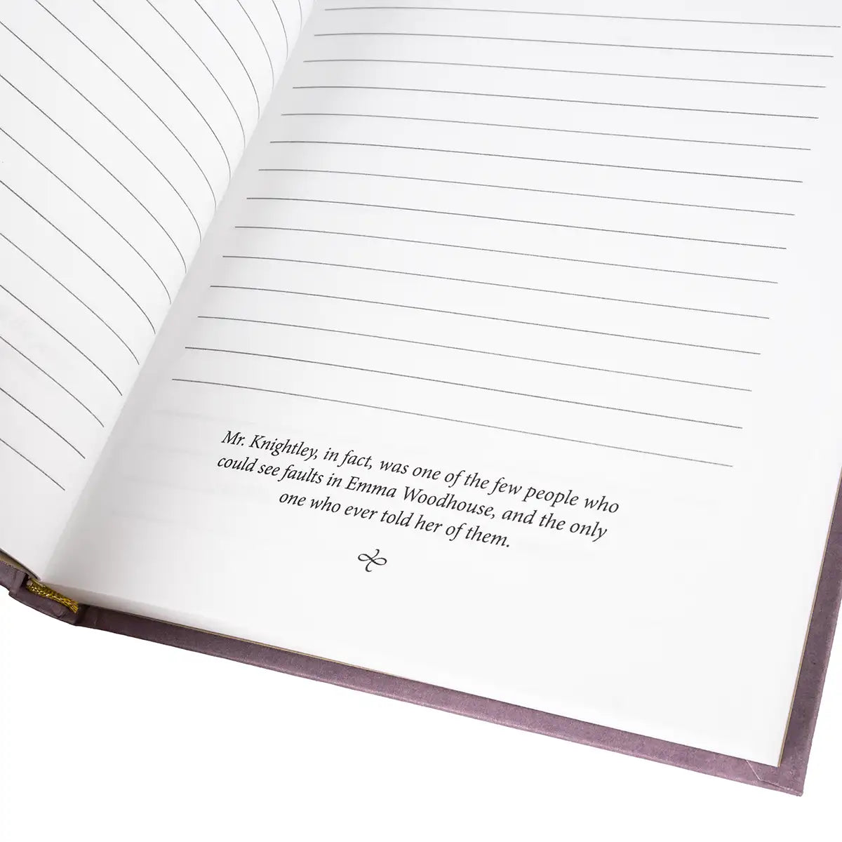 Open book with lined pages and a quote printed on one of them.