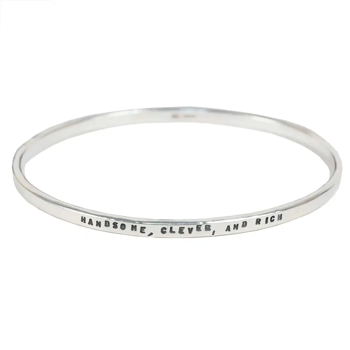 Silver bangle with engraved text 'Handsome, Clever, and Rich' on a white background