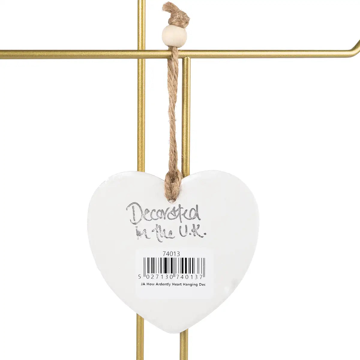 Heart-shaped hanging decor with a gold stand and rope, featuring 'Decorated in the UK' text.
