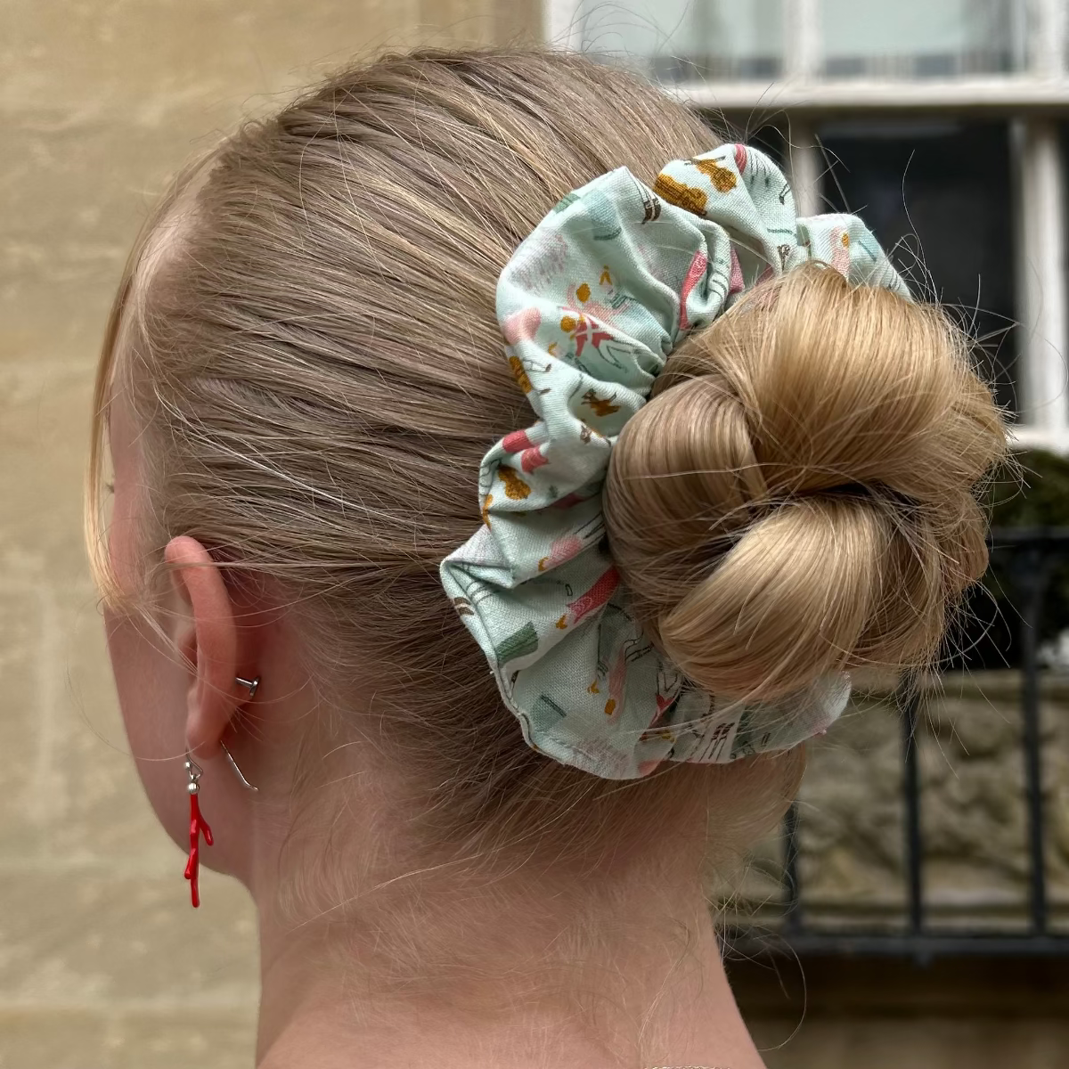 Regency Ball Scrunchie shown on hair in a bun. 