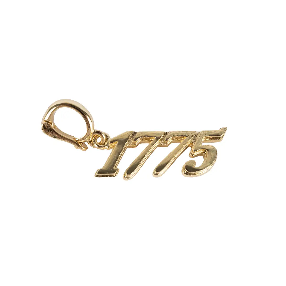 Gold charm with '1775' on a white background