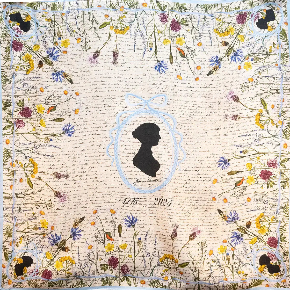 Silk scarf with Jane Austen's silhouette in the middle, surrounded by an illustration of a ribbon in pale blue. Meadow flowers line the edges of the scarf in a square. Dates 1775-2025.