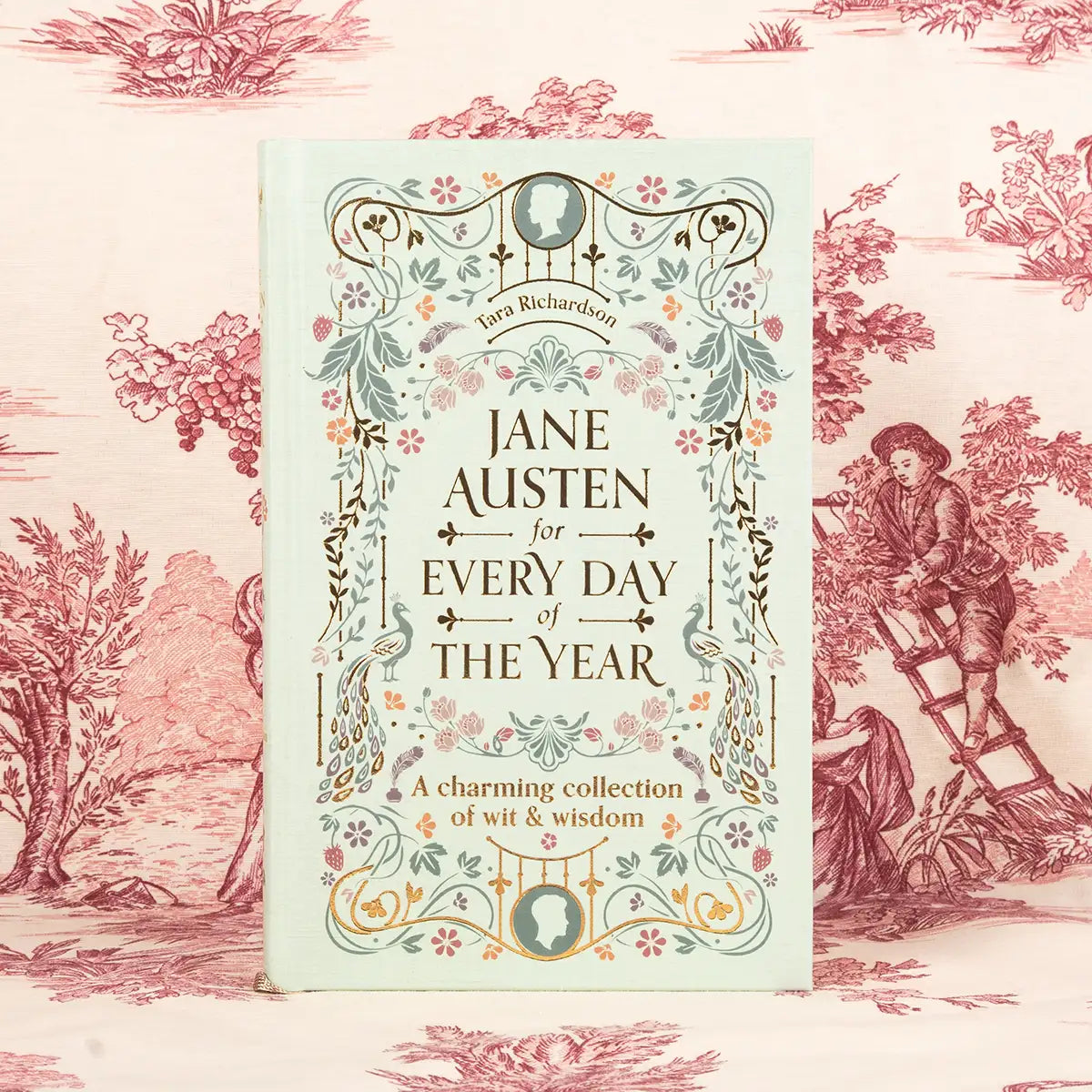 Book titled 'Jane Austen for Every Day of the Year' on a decorative background with floral and classical design elements.