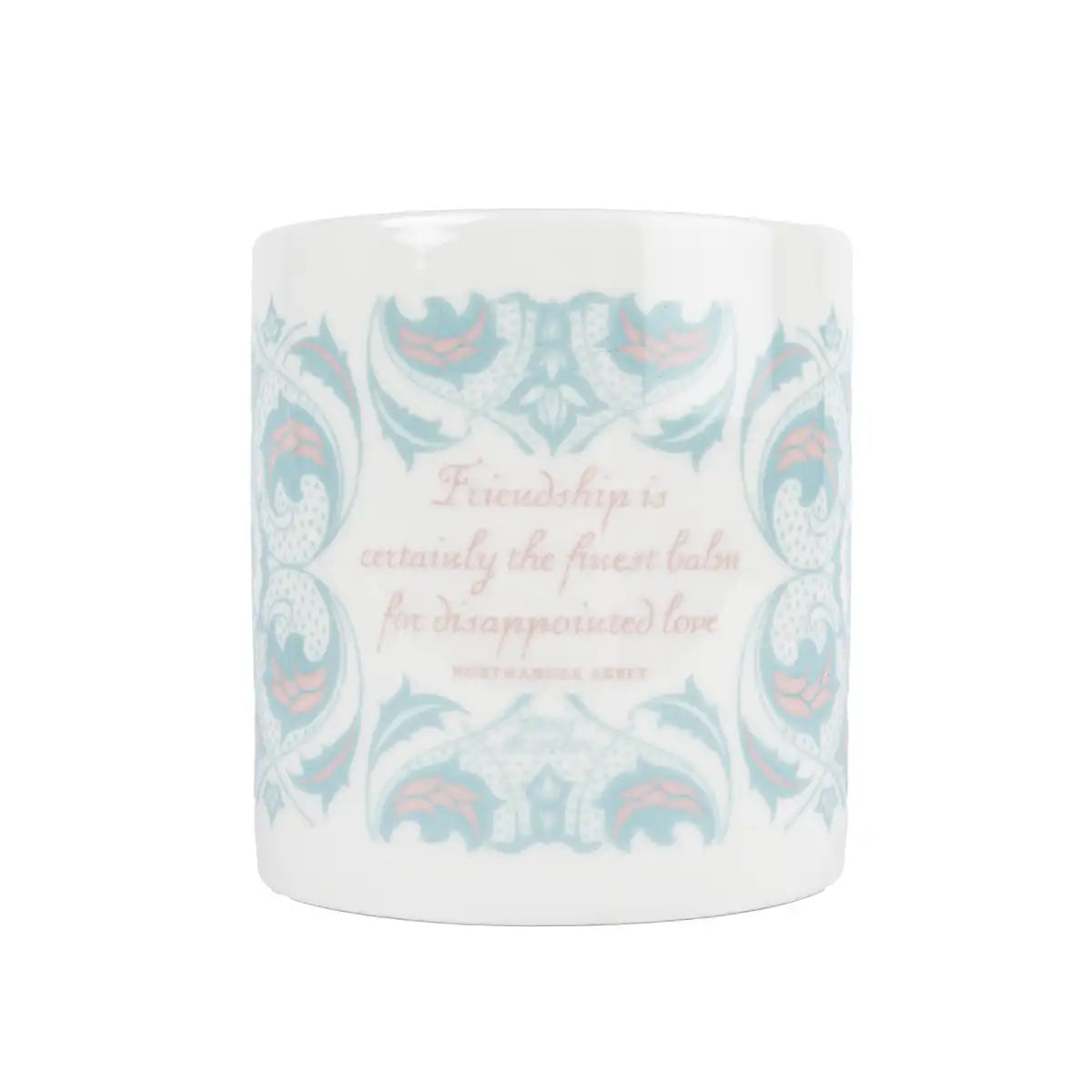 Ceramic mug with decorative pattern and quote 'Friendship is certainly the finest balm for disappointed love' from Northanger Abbey, on a white background.