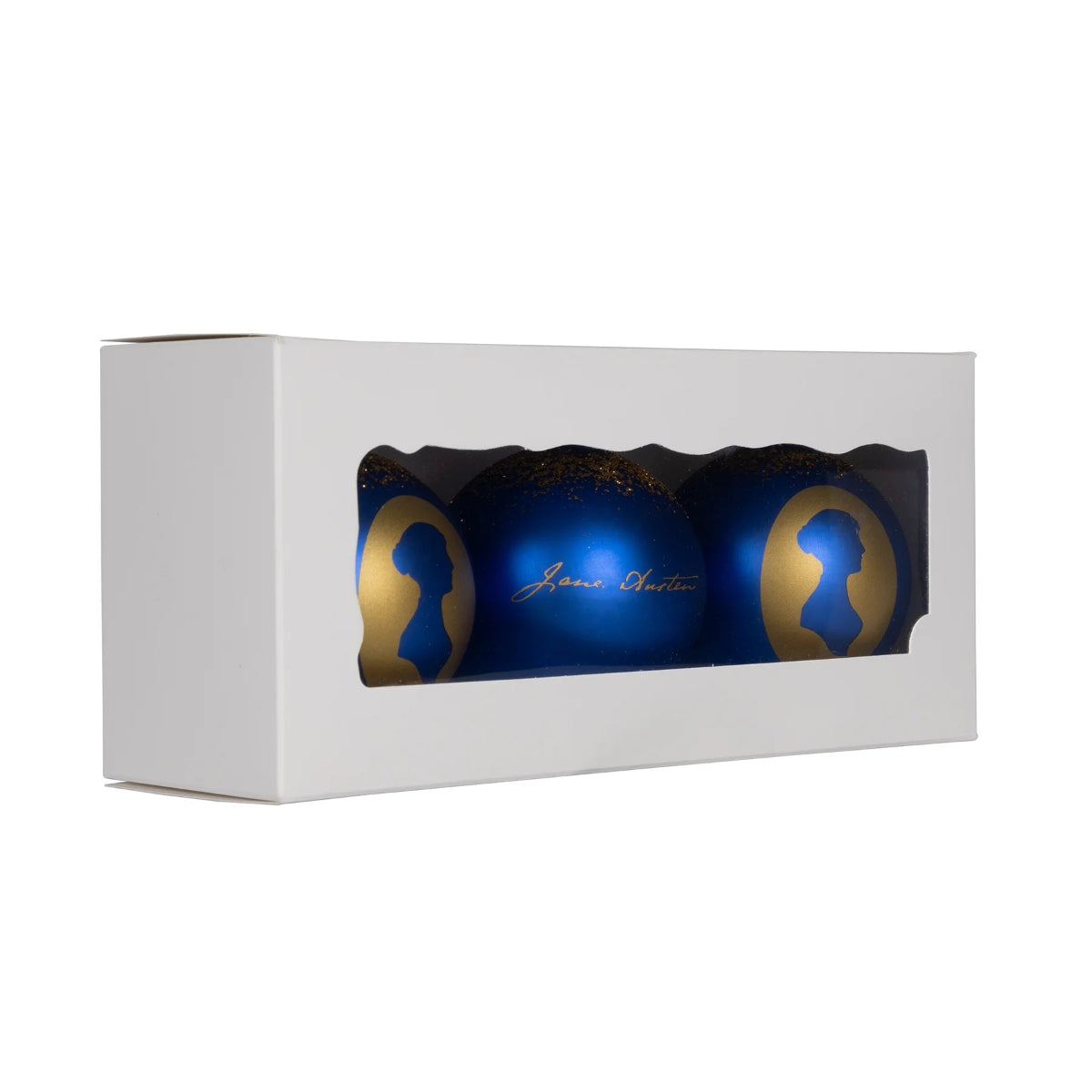Set of three baubles, two silhouette and one signature design, are in a white box. The box is slightly diagonal on a white background.