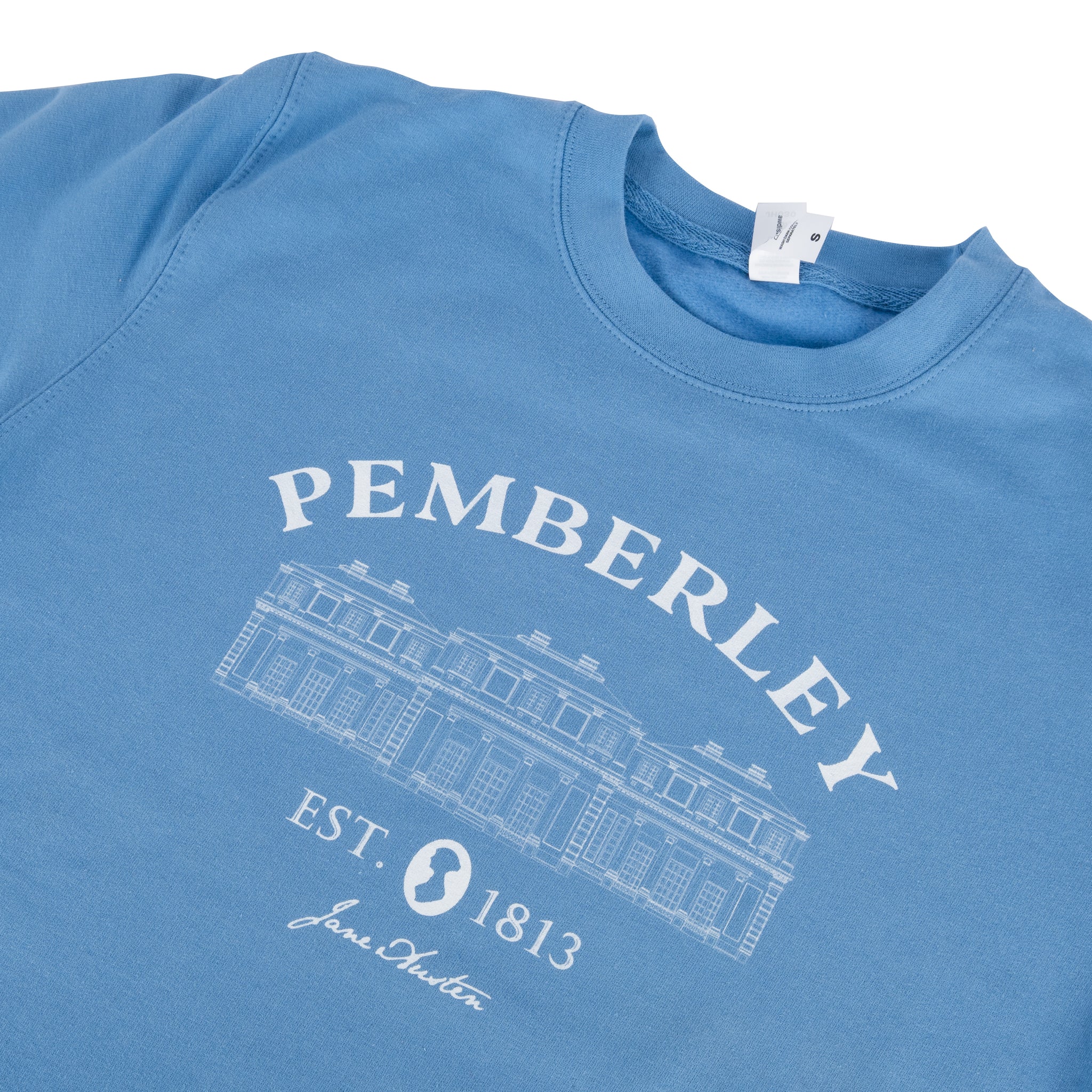Pemberley Sweater in Soft Blue. Sweater has image of Pemberley Estate from Pride and Prejudice with text reading 'Est. 1813'.