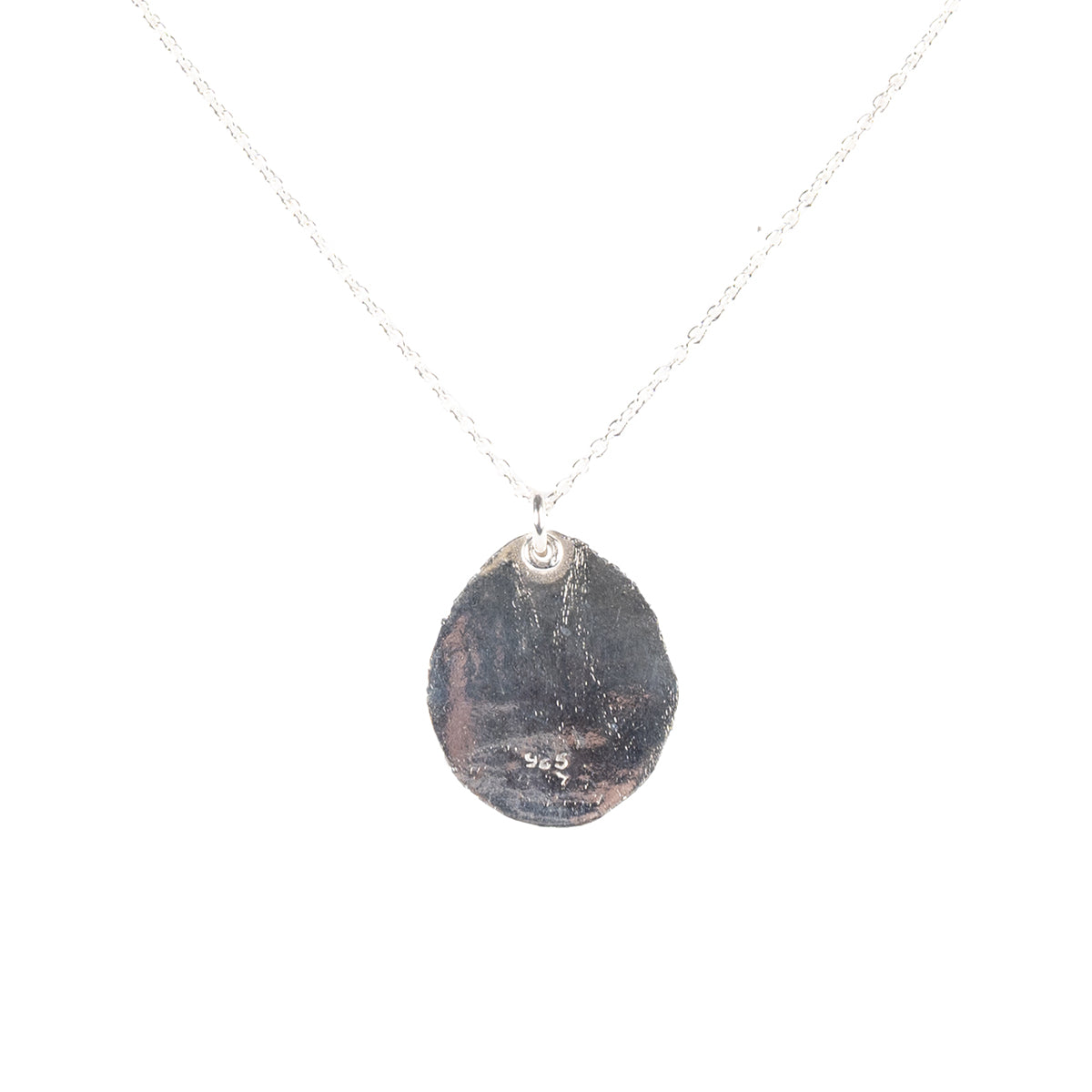 No background. Back of the pendant.